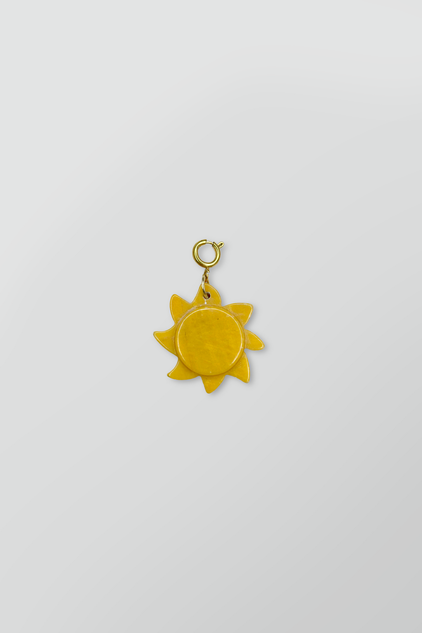 STONE SUN CHARM